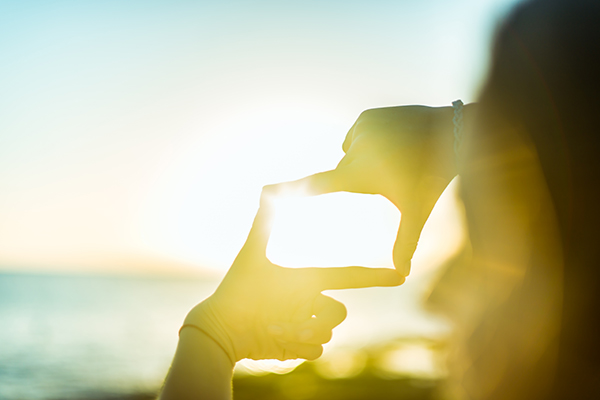 Person looking at a sunrise 