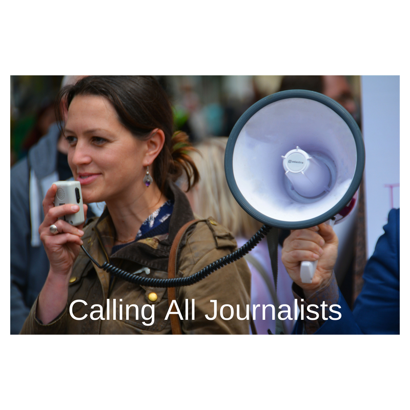 woman in crowd using megaphone