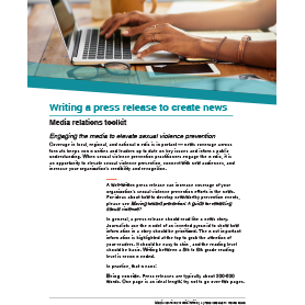 Publication cover showing a person typing on a laptop
