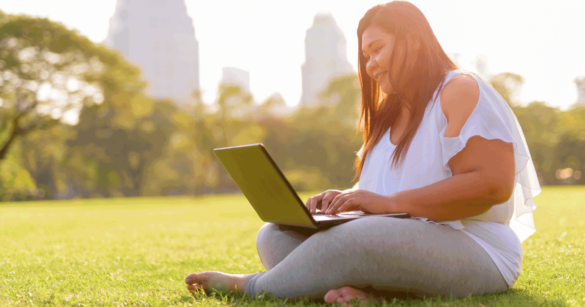 Woman using a laptop outside