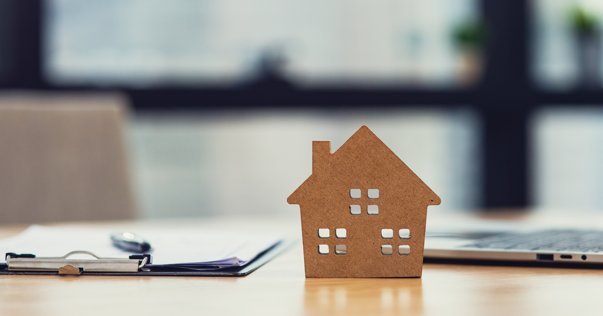 Cutout of a house on a desk