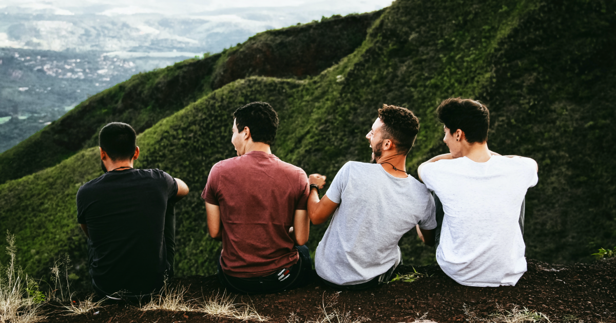 Group of men talking and laughing