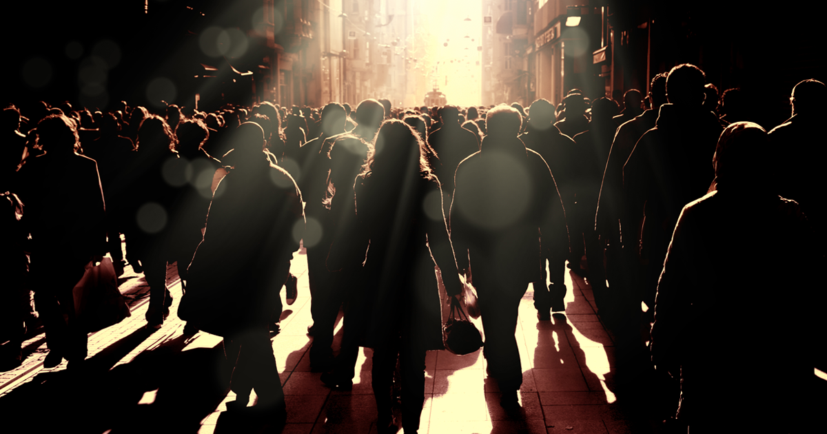 silhouette of a crowd of people walking
