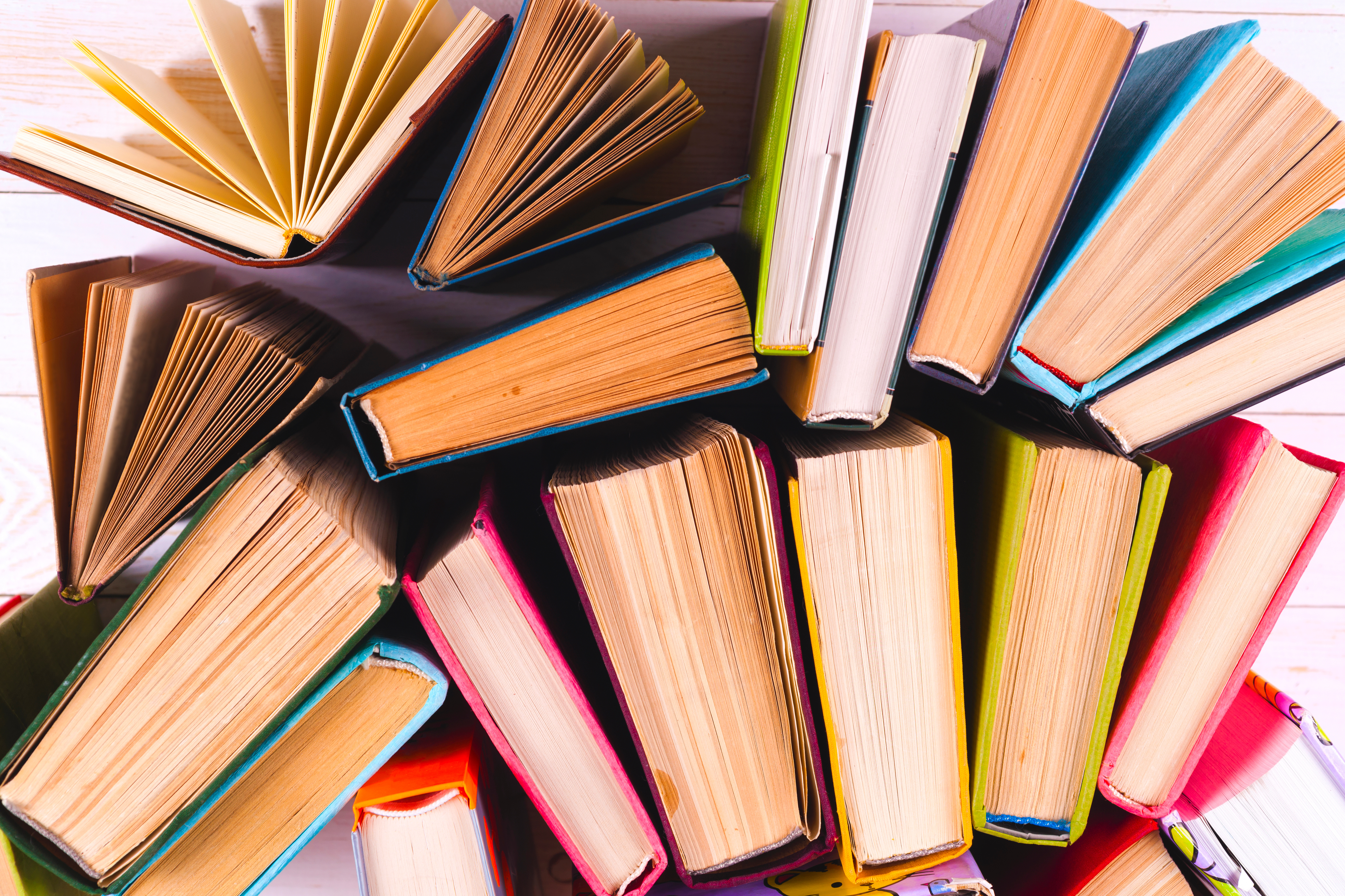 a collage of hardcover books in aerial view