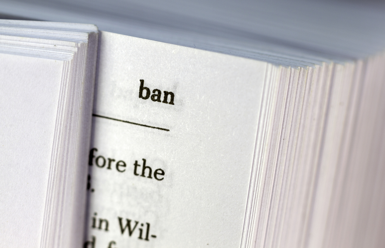 istock-525988251.jpg Image shows a zoom up on the word 'ban' in the dictionary at the top of an open page. Definition of the word is implied, but full text is obscured, as page is barely opened.