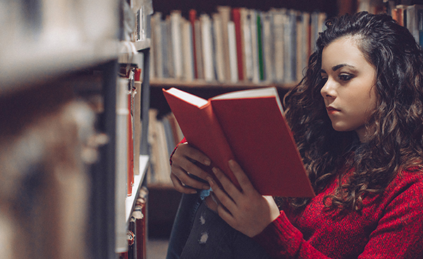 Young woman reading a book