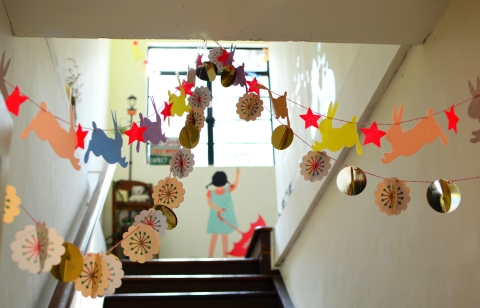 School hallway with stairs and craft banners hanging from the walls