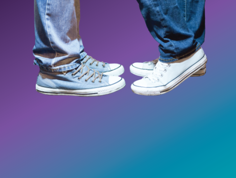 Image of two pairs of feet in shoes, toe-to-toe