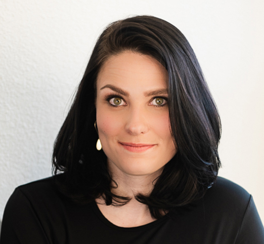 Headshot of a white woman with black hair
