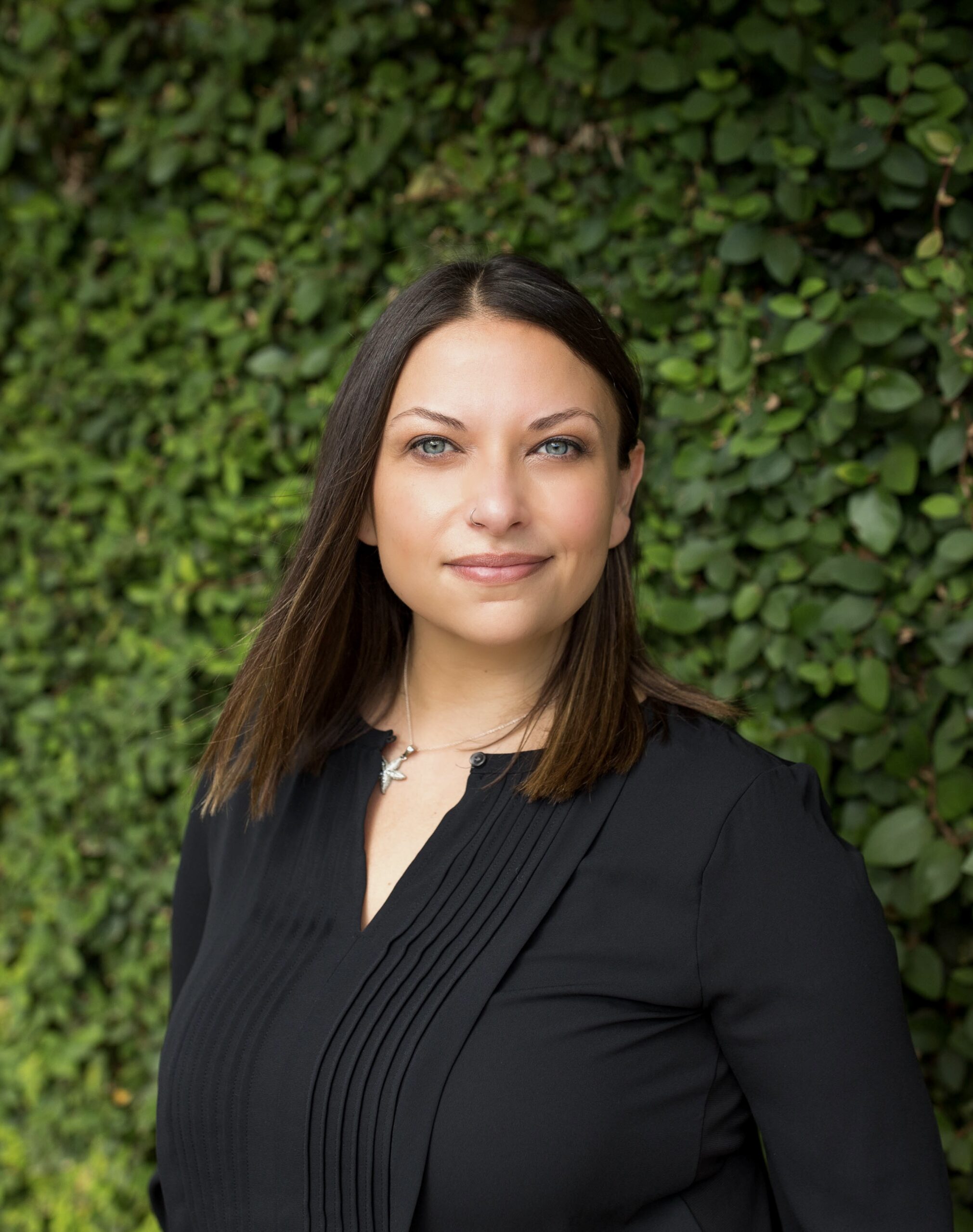 Young brunette woman standing outside