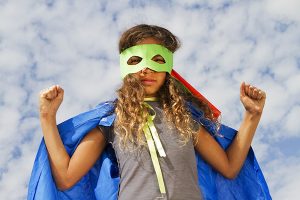 Young girl in a superhero costume