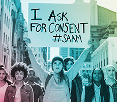 Image of college student holding a sign