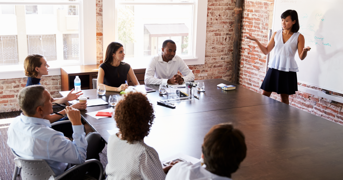Woman giving a presentation in a boardroom